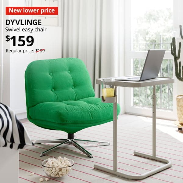 A mid shot of a green DYVLINGE swivel easy chair in a bedroom setting. In the top left corner, a red tag with white text reads 'New lower price'. Accompanying white text displays: 'DYVLINGE, Swivel easy chair, $159, Regular price: $189'