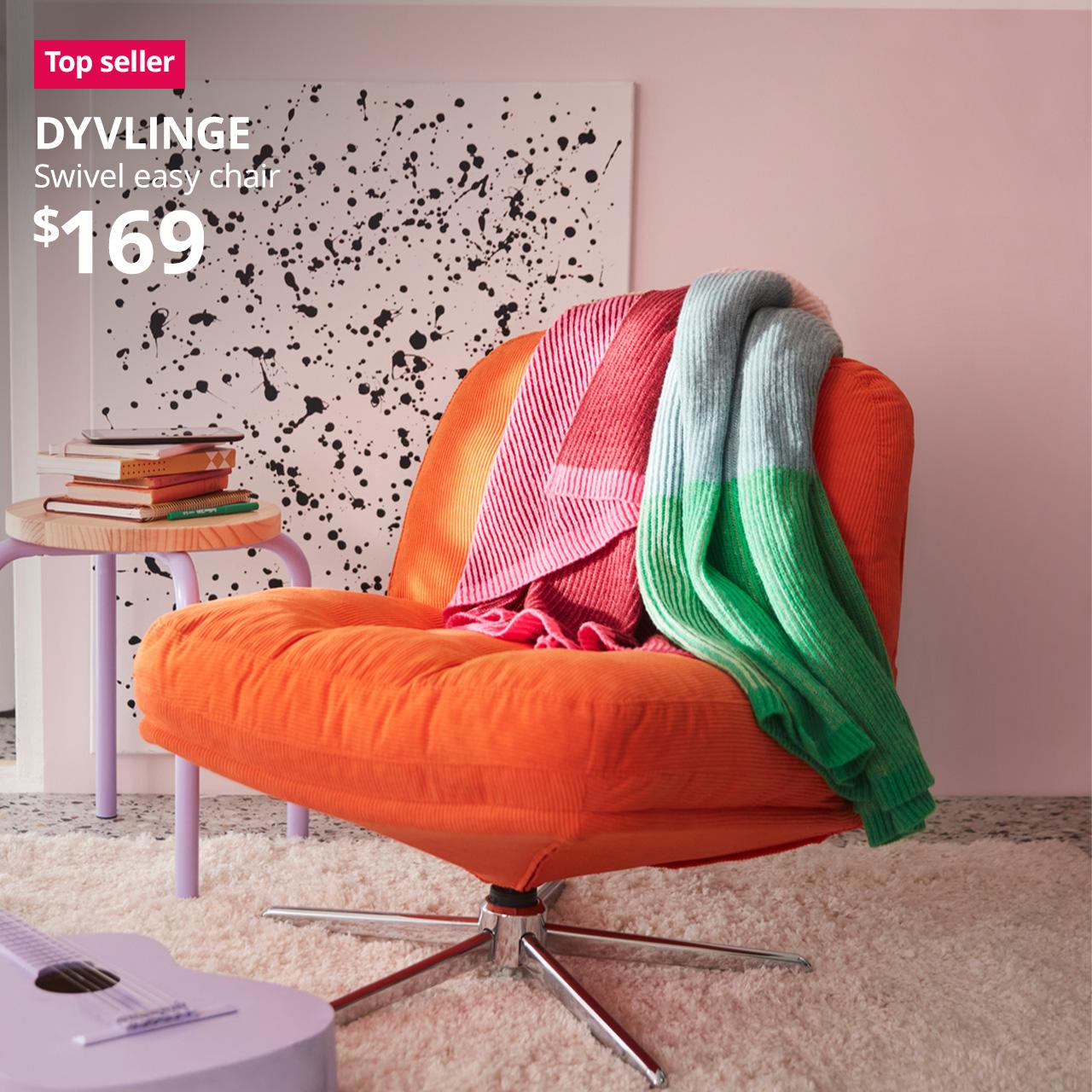 A mid shot of a Kelinge orange DYVLINGE swivel easy chair placed on a white rug with pink/green throws placed on it. A reddish pink "Top seller" tag is displayed on the top left corner of the image, followed by a white text overlay image that reads, "DYVLINGE, Swivel easy chair, $169"