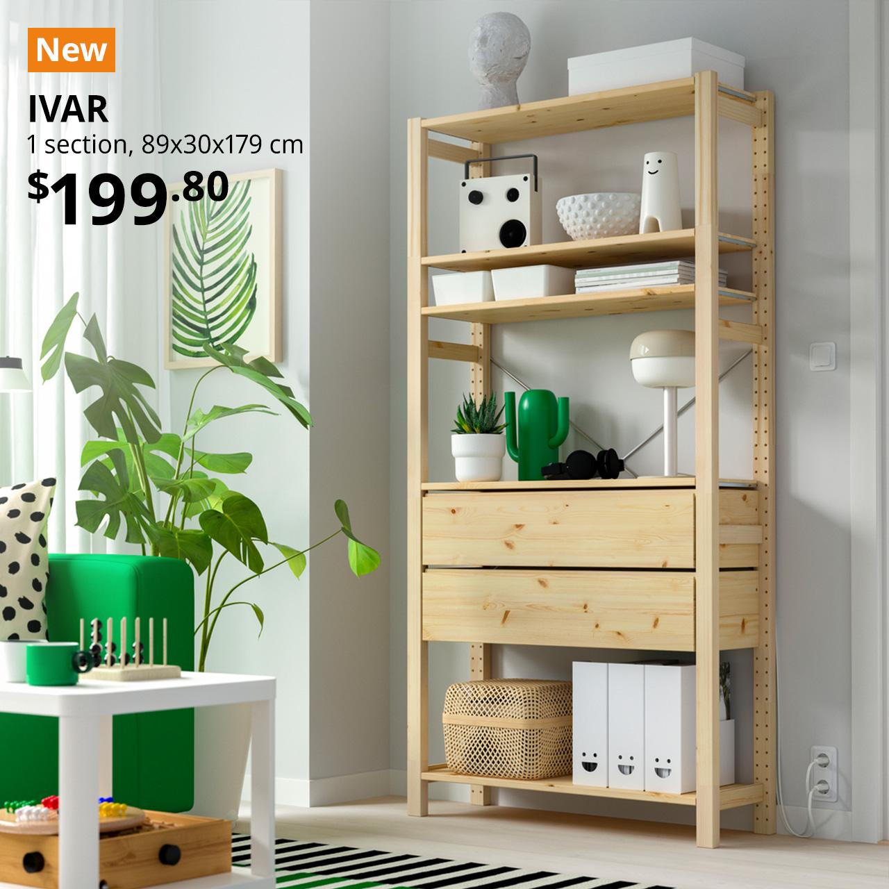 A mid-shot of a pine IVAR shelving with 2 drawers in a living room setting being utilise as a display and storage shelf. Orange tag with white text that reads "New". Black text overlay image that reads "IVAR, 1 secion, 89x30x179 cm. Price at $12.90."