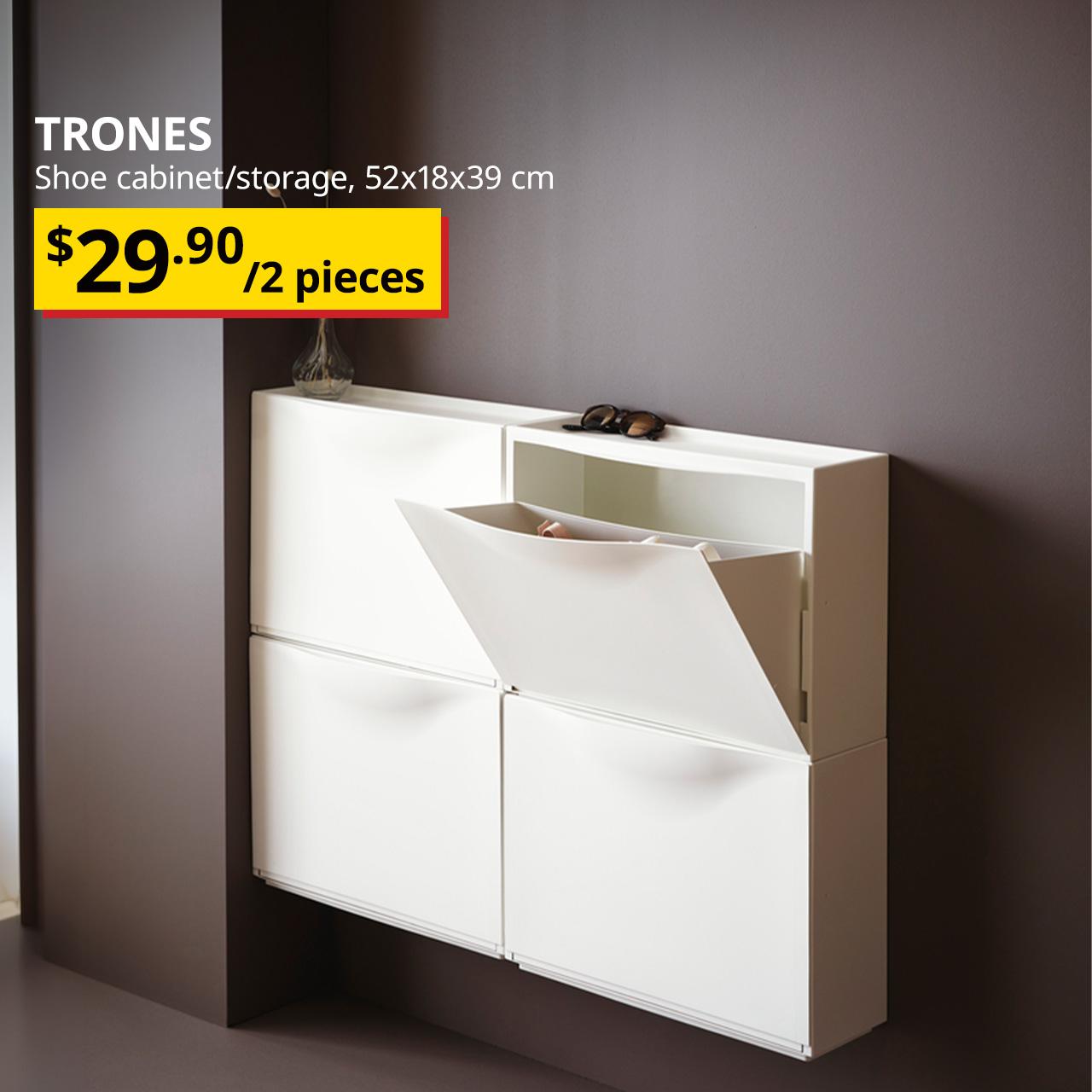 A mid shot of the main entrance walkway featuring 4 white TRONES mounted onto the wall for shoe storage. On the top left corner, white text overlaying image that reads 'TRONES, Shoe cabinet/storage, 52x178x39 cm', followed by breath-taking price tag in yellow/red with black text that reads '$29.90/2 pieces'.