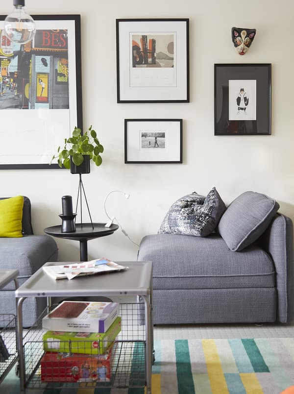 A modular grey sofa and picture gallery.