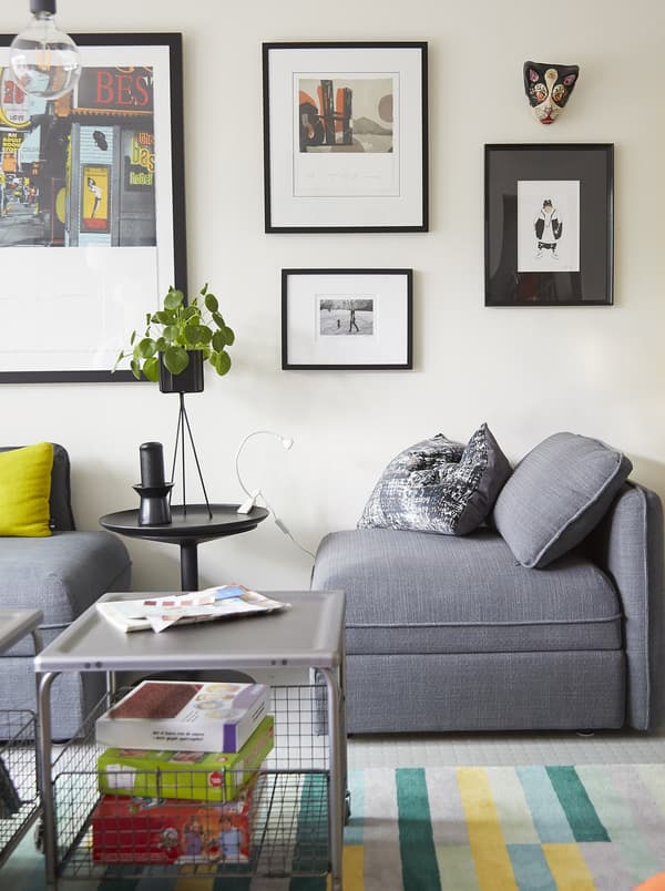 A modular grey sofa and picture gallery.