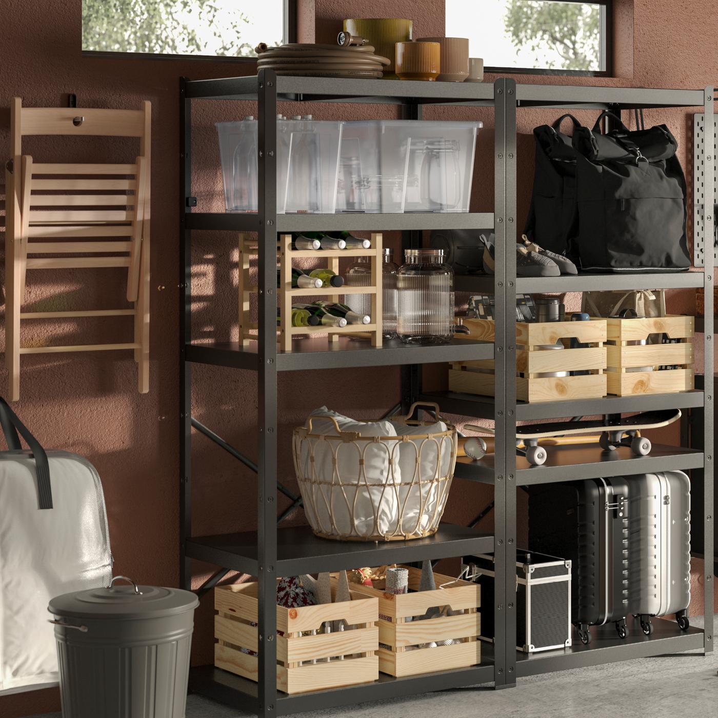 A neatly arranged garage wall with equipment and accessories in KNAGGLIG and SAMLA boxes in a BROR storage combination.