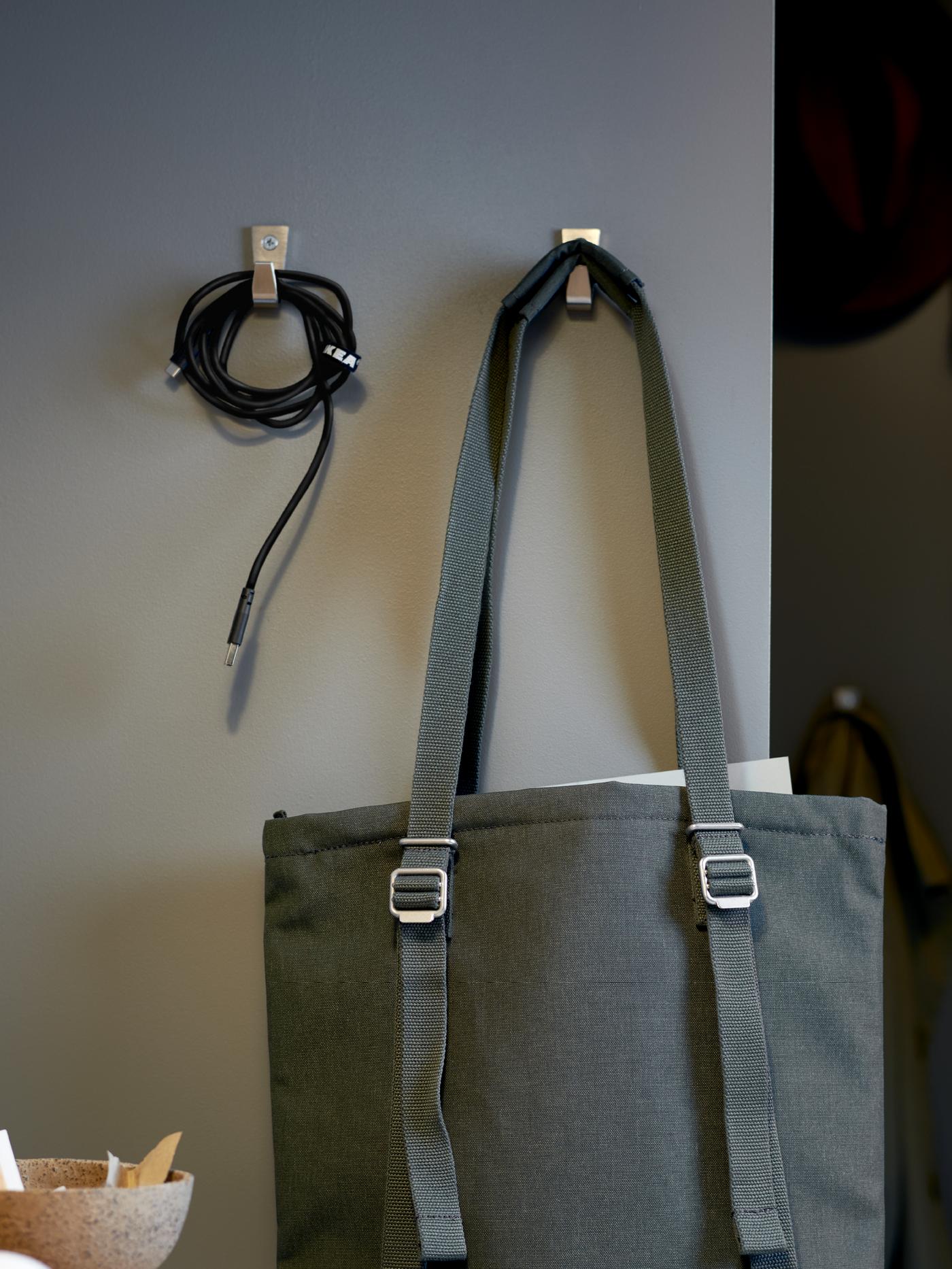 A nickel-plated BLECKA hook in the home office