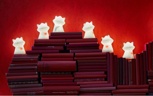 A night light like LURIGA raccoon from IKEA can scare off monsters and radiate security. It has a pulsating red heart, too, which makes it a sweet way to show someone you love them. You can stack red books like a heart and put lots of LURIGA on top.