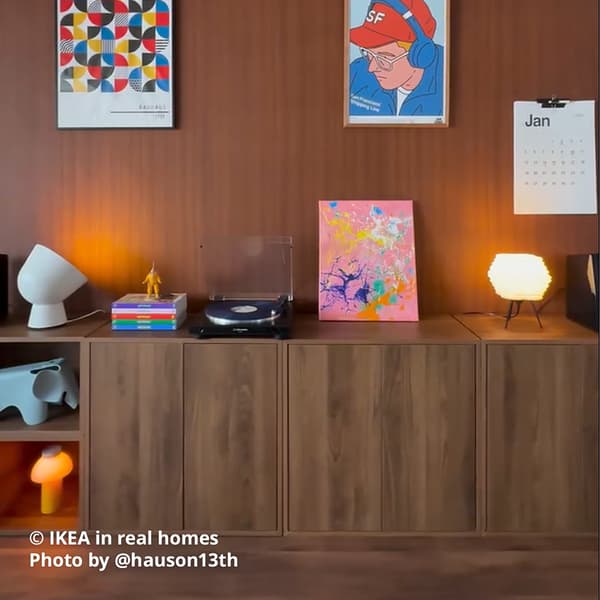 A number of brown walnut effect EKET cabinet is placed next to each other to create a sideboard in a living room setting. IKEA in real homes Photo by @hauson13th.