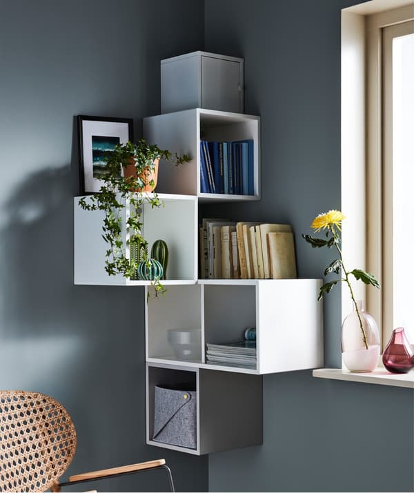 A patchwork of different-size frames with themed motifs round a corner creates a unique and strong expression.