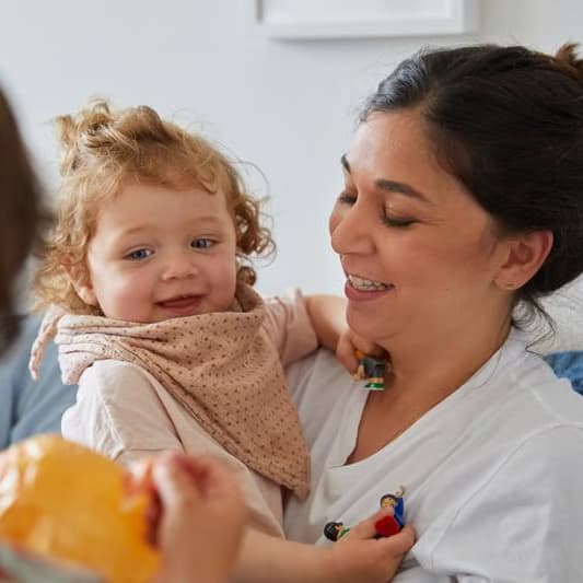 a person holding a baby