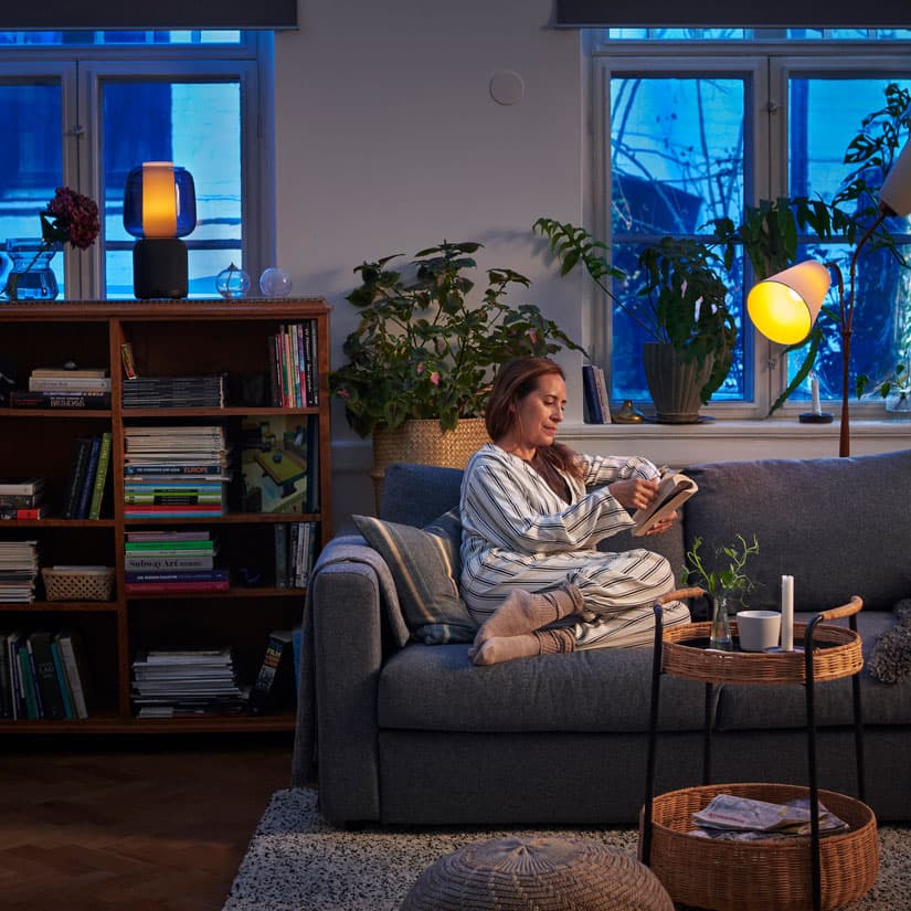 a person on their couch using the IKEA home smart app