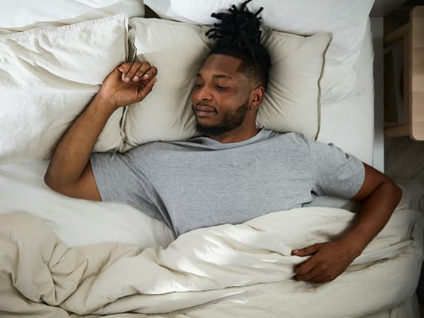 a person sleeping on their back