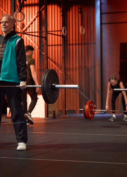 A person working out with weights in a gym.