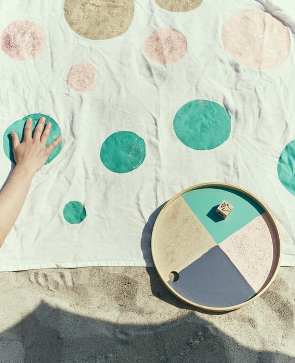 A picnic basket is painted to create a game mat.