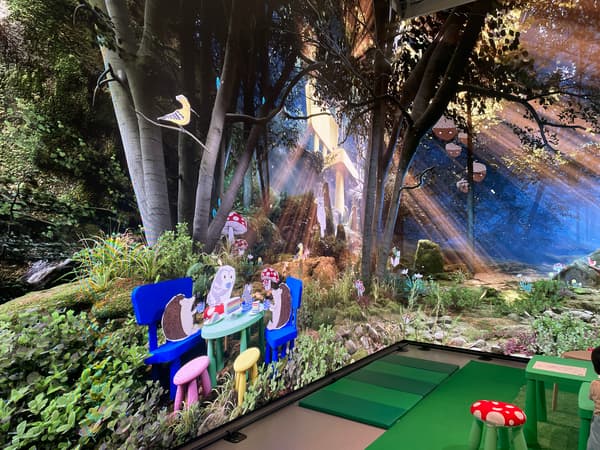 A picture of the Oxford Street IKEA store live studio showing screens depicting a forest with cartoon animals.