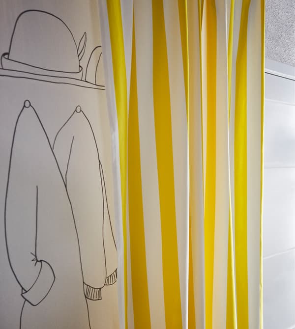 A piece of fabric can hide the clothes rack you don’t want seen.