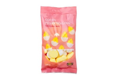 A pink package of candy with yellow cartoon chicks in an egg shell on the label. 