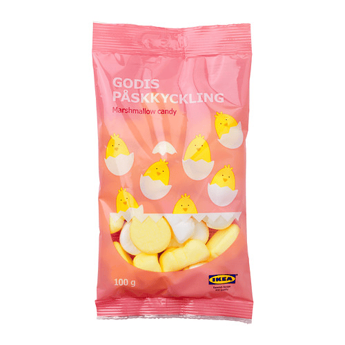 A pink package of candy with yellow cartoon chicks in an egg shell on the label. 