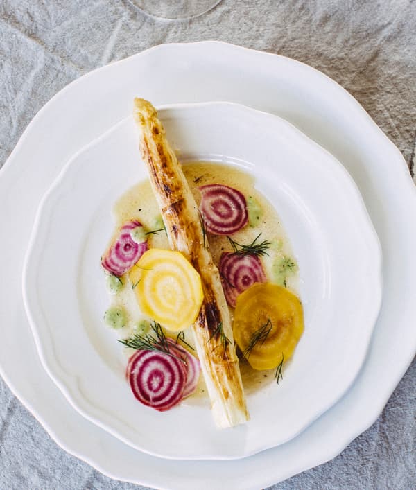 A plate of grilled white asparagus and pickled beetroot.