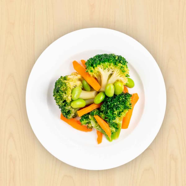 A plate of mixed vegetables — carrots and broccolis, beans