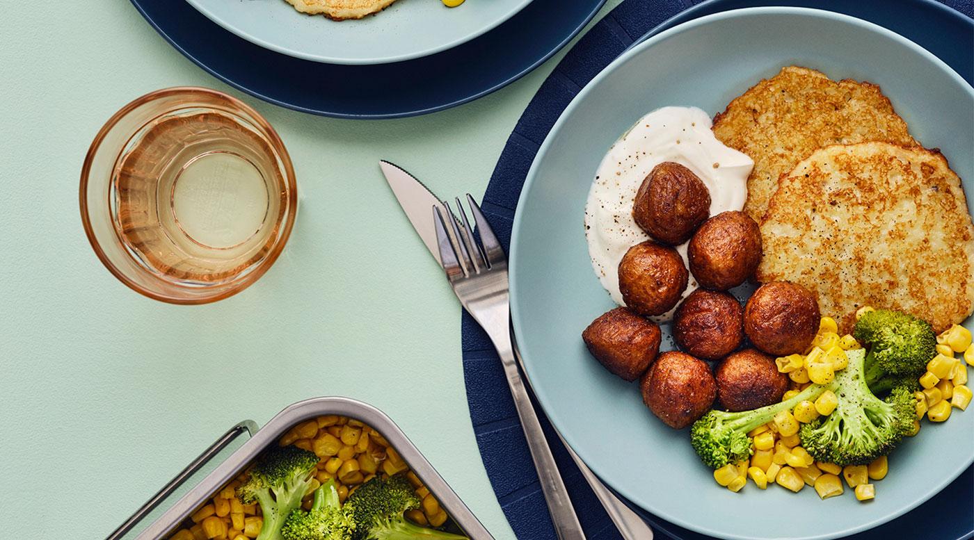 A plate of plant balls with crispy rösti & veggies.