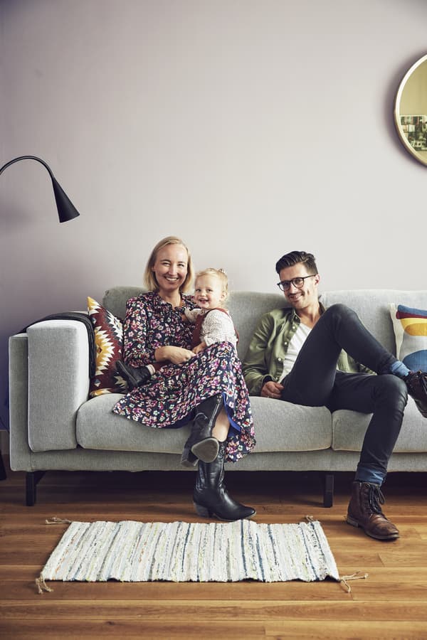 A portrait of Marrit, Jelmer and Mia on their sofa.