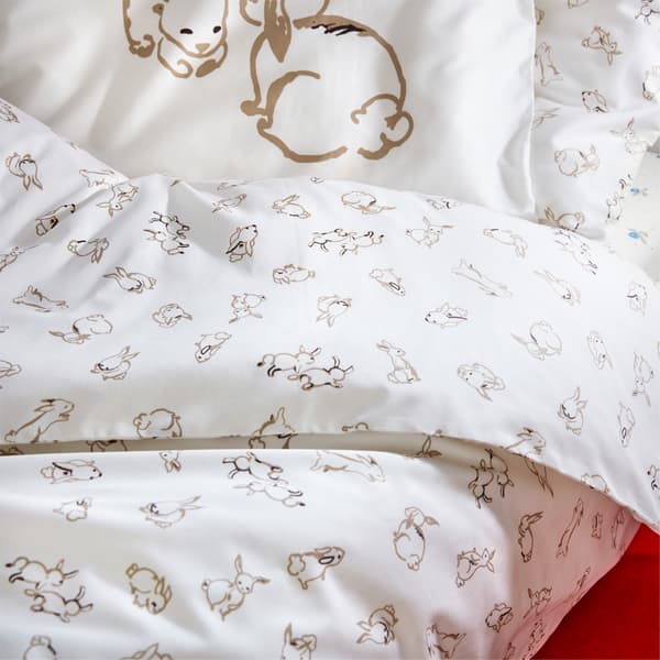 A RÖDHAKE quilt cover printed with a rabbit pattern on a light-colored background.