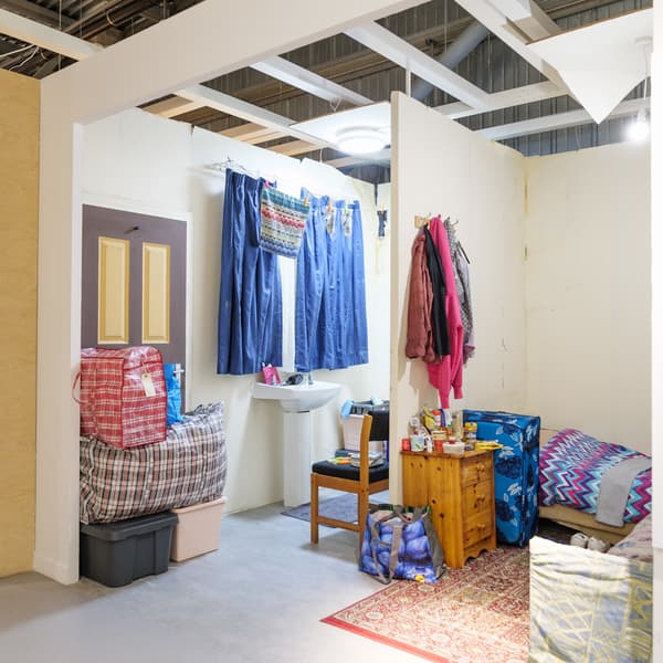 A room set inside IKEA Bristol that shows the poor living conditions of thousands of families