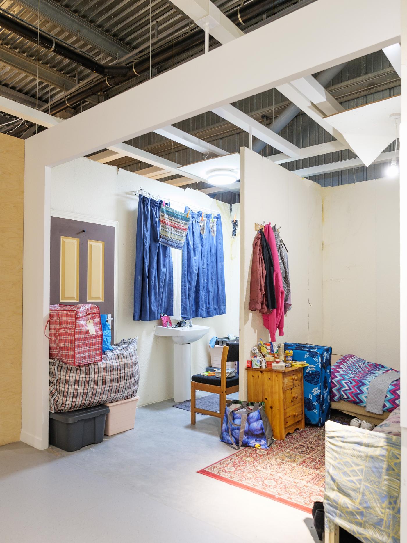A room set inside IKEA Bristol that shows the poor living conditions of thousands of families