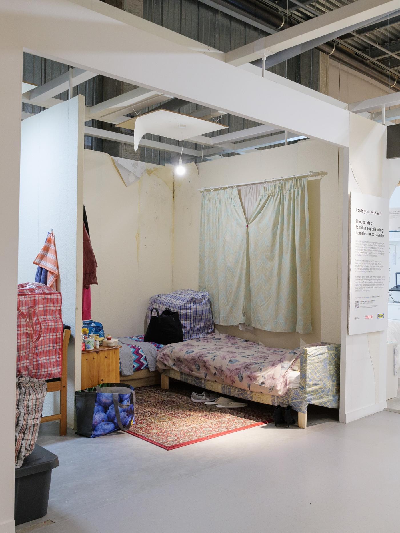A room set inside IKEA Bristol that shows the poor living conditions of thousands of families