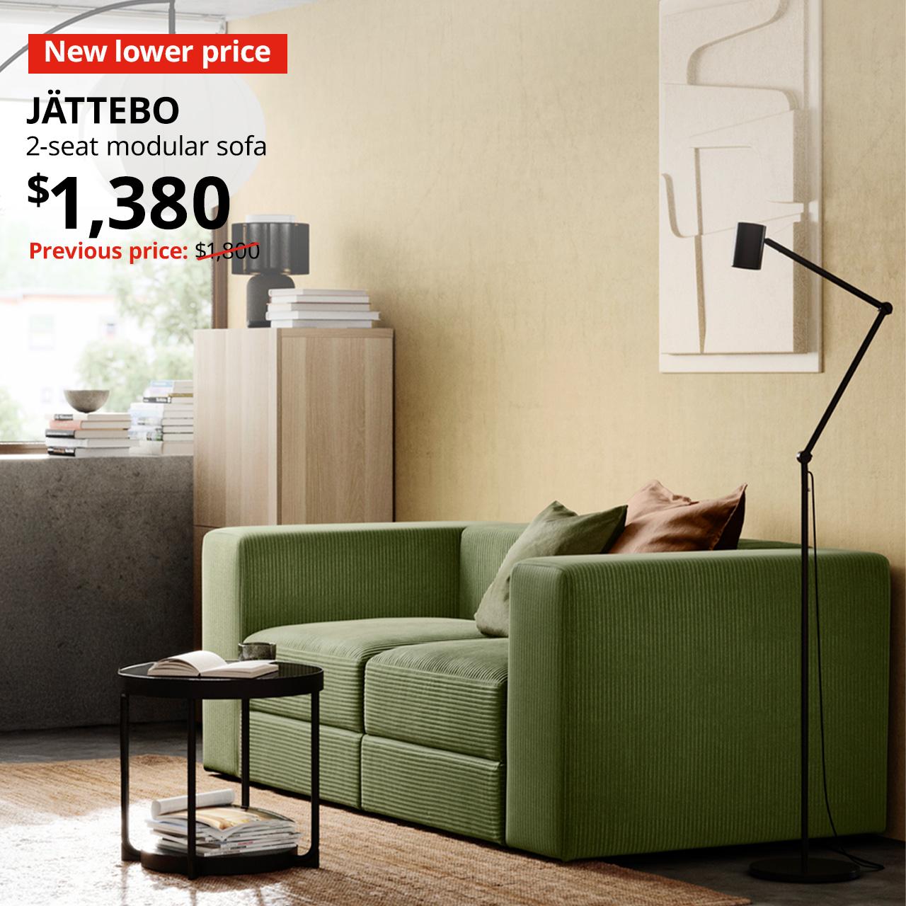 A samsala dark yellow-green JÄTTEBO 2-seat modular sofa in a living room setting with New lower price tag. Price: $1,380. Usual price with red slash: $1,800.