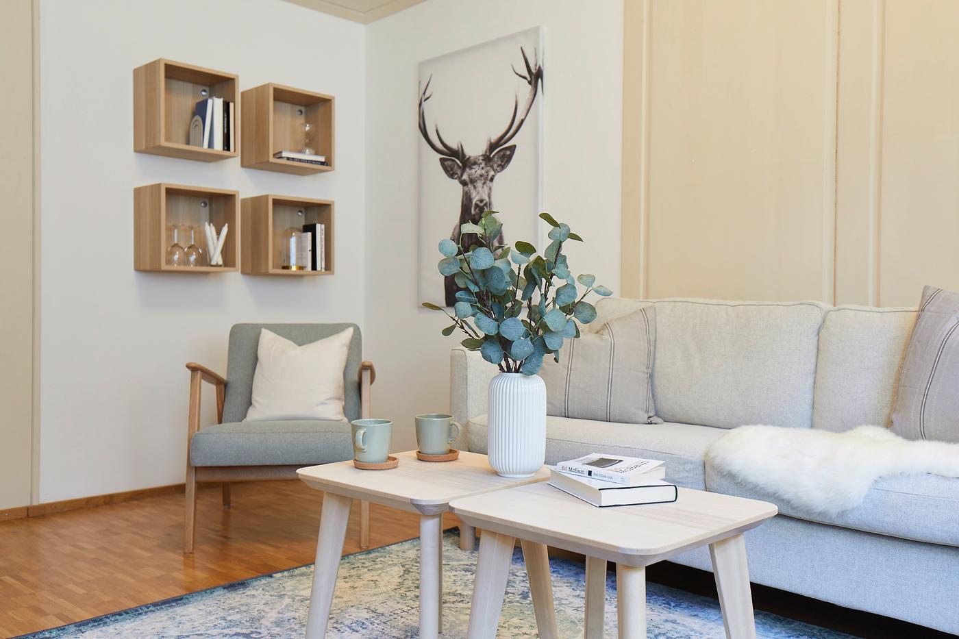 A Scandinavian living room decorated in bright colours in a bed & breakfast holiday apartment