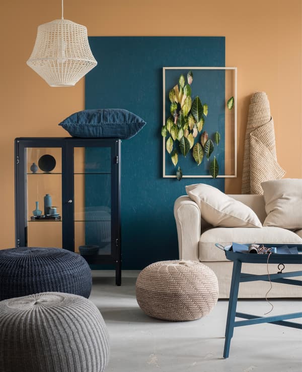 A selection of small home furnishing accessories in neutral hues and blue accents.