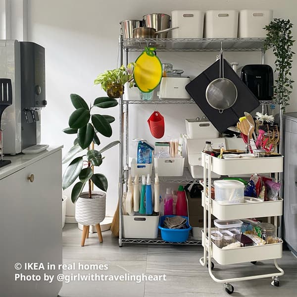 A service yard/laundry area with OMAR shelving and white RASKOG trolley featuring IKEA in real homes Photo by @girlwithtravelingheart