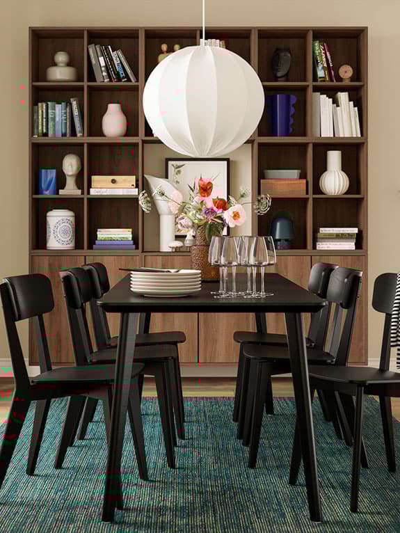 A set of black LISABO dining chairs with table