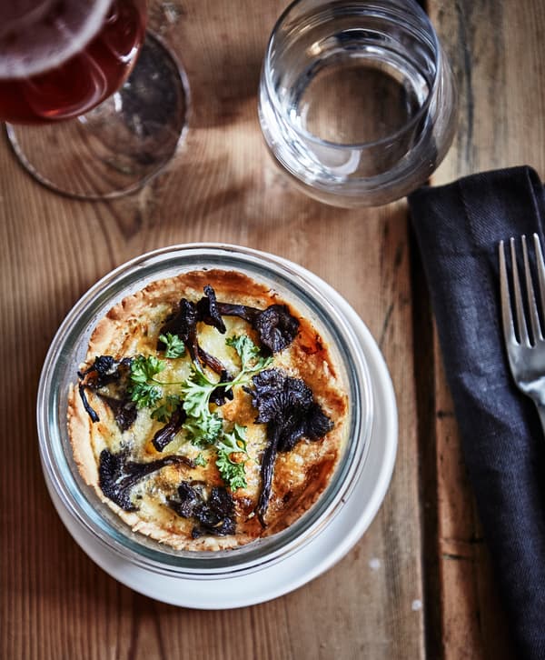 A shot from above of a Frech-style savory tart in a small casserole dish.