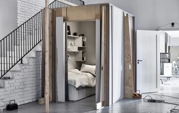 A shot  of a small sleeping space next to a staircase in out Ideas lab.