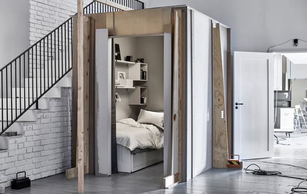 A shot  of a small sleeping space next to a staircase in out Ideas lab.