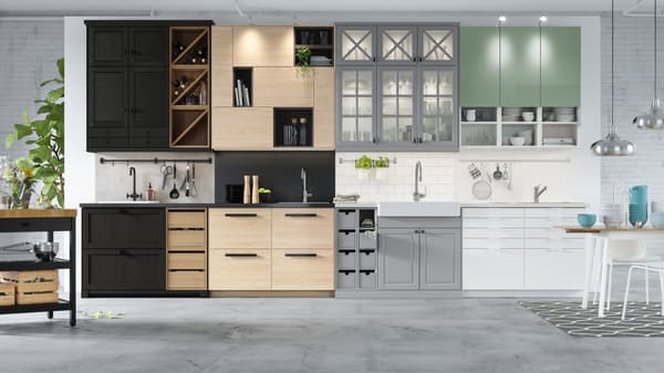 A showroom showing all METOD kitchen door front designs, including: LERHYTTAN black stained fronts, ASKERSUND light ash effect fronts, BODARP grey-green fronts and grey fronts, and RINGHULT high-gloss white fronts.