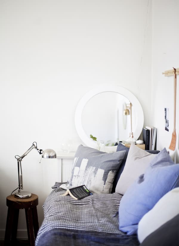 A sideboard doubles as a bedside table