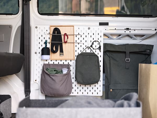A SKADIS pegboard mounted to the inside of the van
