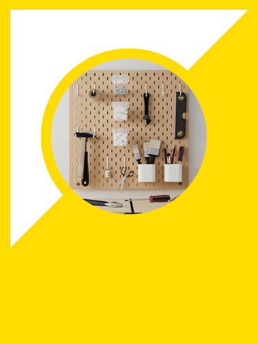 a SKADIS pegboard with tool mounted on it