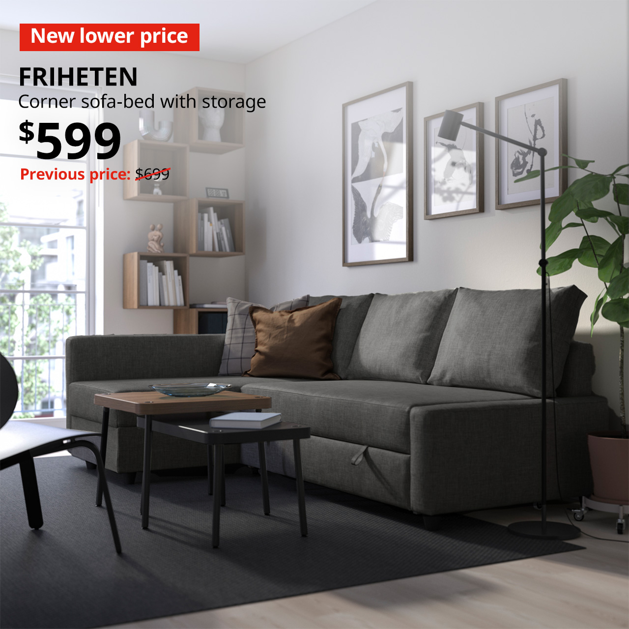A skiftebo dark grey FRIHETEN corner sofa-bed with storage in a living room setting with New lower price tag. Price: $599. Usual price with red slash: $699.