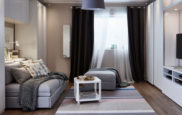 A small living room is set up in its living room function.