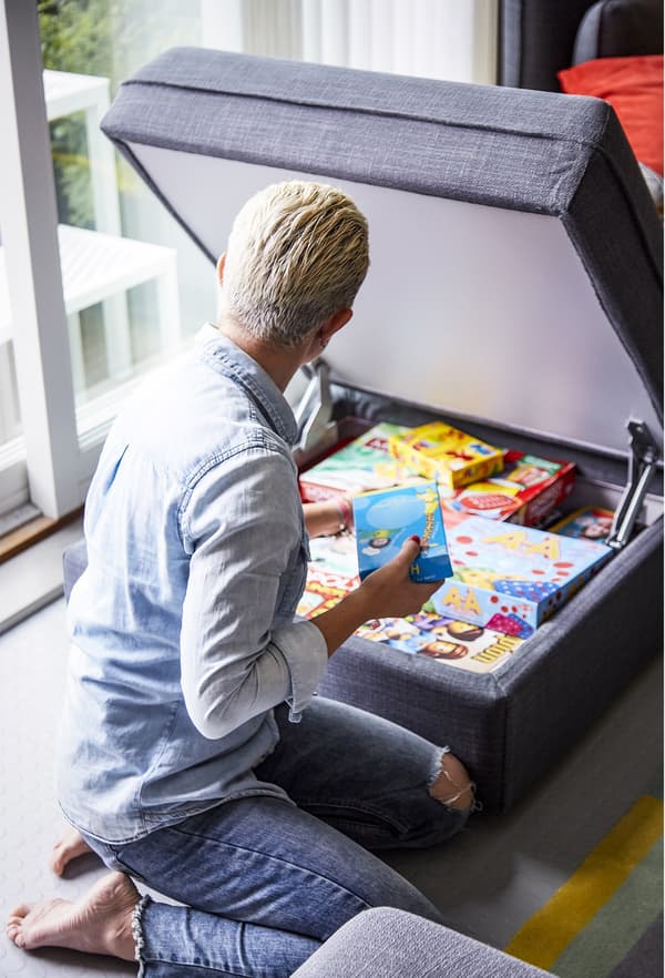A sofa seat module with storage inside.