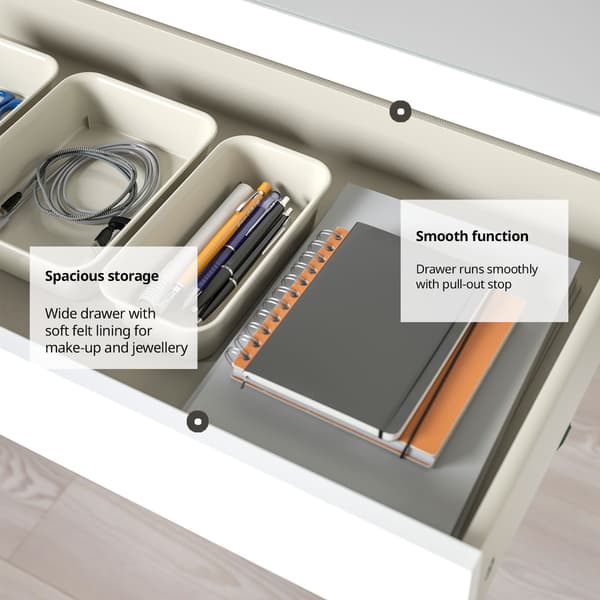 A spacious drawer organized with stationery, notebooks, and accessories, featuring a soft felt lining and a smooth pull-out function.
