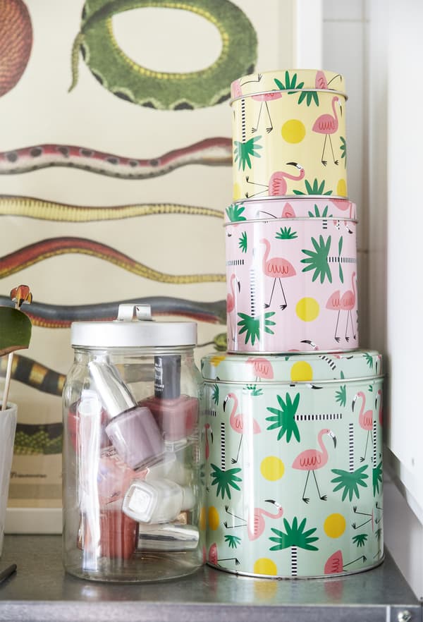 A stack of brightly patterned tins.