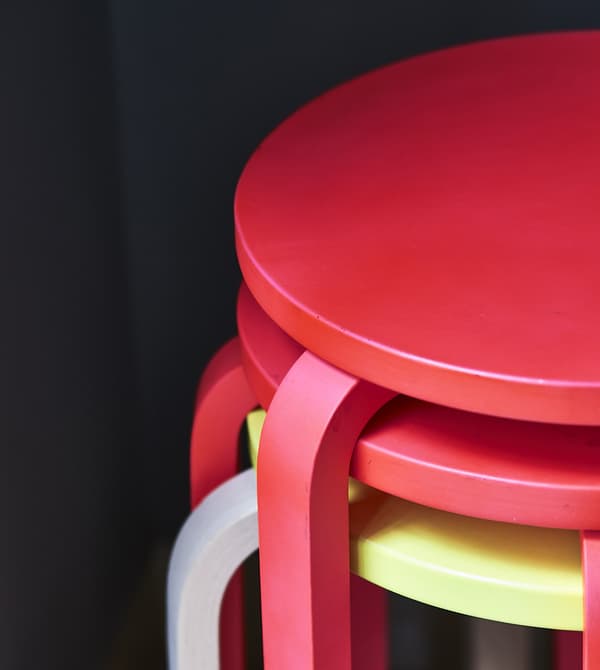 A stack of colourful stools.