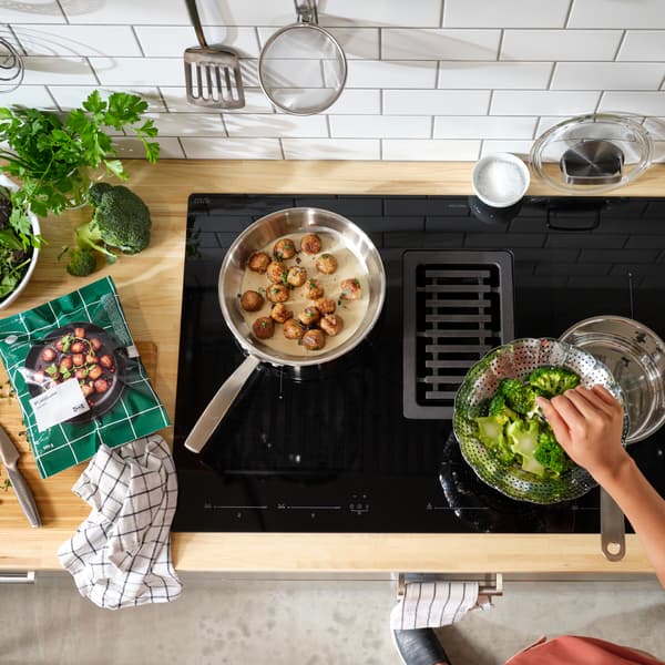 A stainless steel KLOCKREN steamer insert in the kitchen