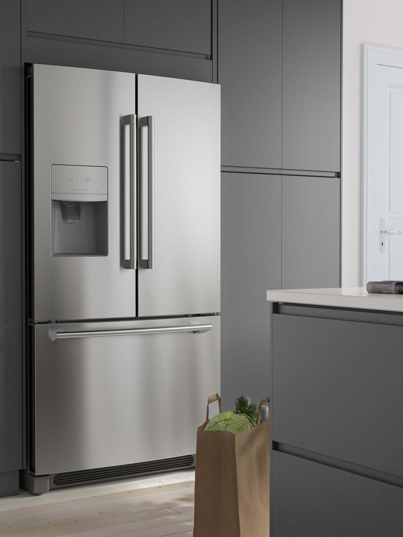 A stainless steel refrigerator with gray cabinets surrounding it.