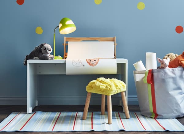 A storage bag and children’s stool can be used during nursing years and later during years of play 