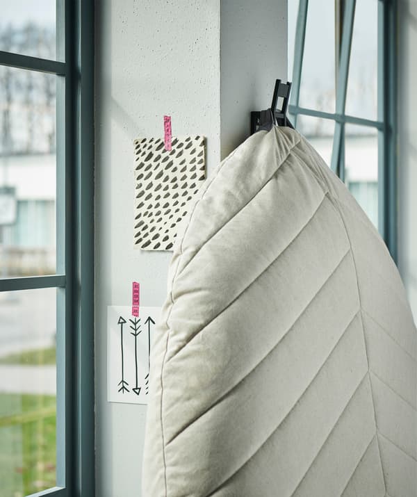 A sturdy hook can do the job of many a larger piece of storage furniture.